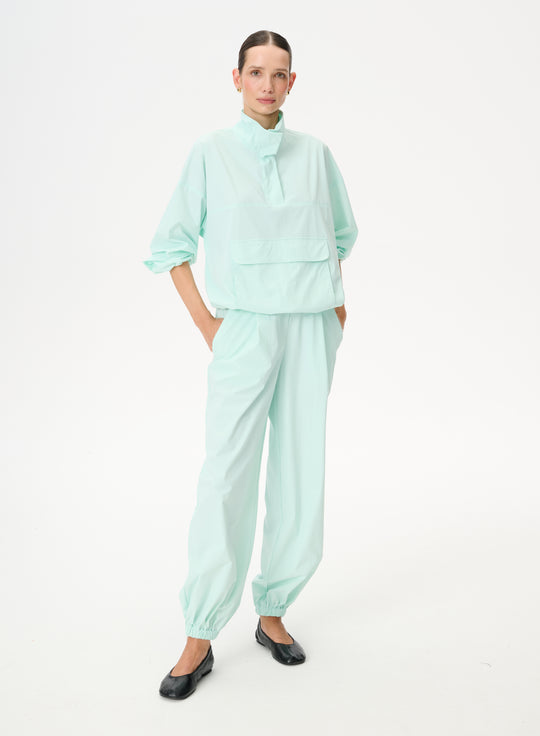 Spodnie z ortalionu ze ściągaczami w kolorze akwamarynowym - Lenny